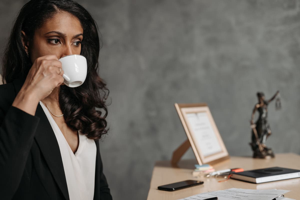 Professional portrait of a female lawyer with a modern office background